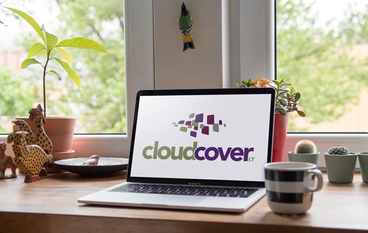 lead Laptop with Cloud Cover IT logo on the screen